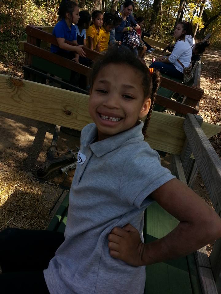 A young visitor riding the tractor-pulled Hey Hey Hayride at Shuckle's